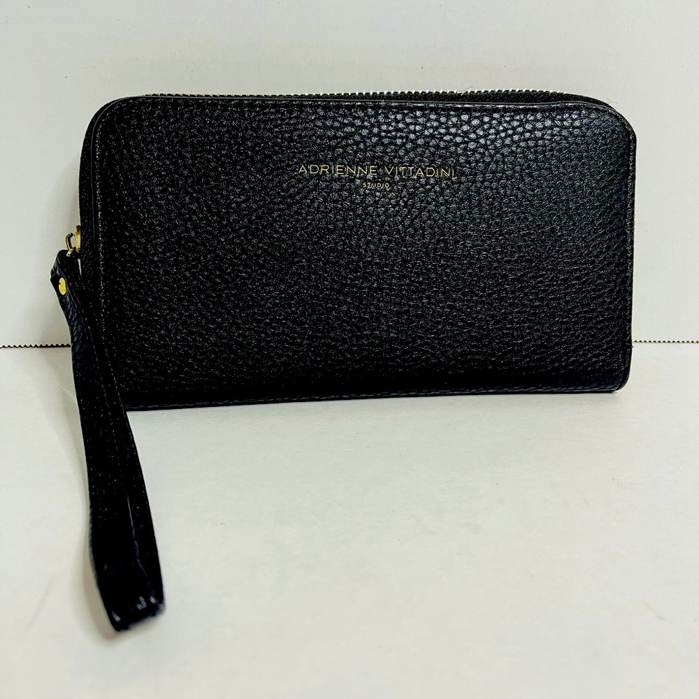 Adrienne Vittadini Studio cell phone charging wallet/clutch with wristlet strap.